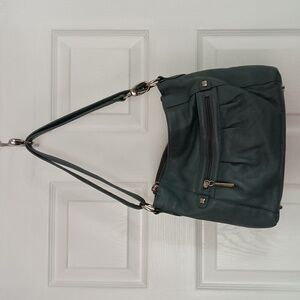Stone mountain leather bag. Lots of pockets. Gently used no stains.